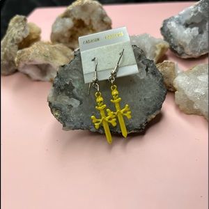 Yellow skull sword dangling earrings